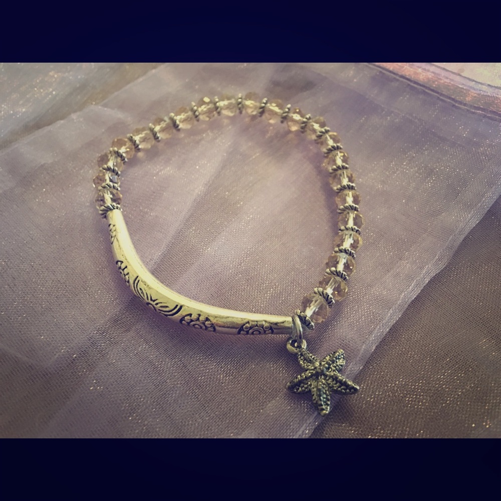 Handmade beaded bracelet with charm